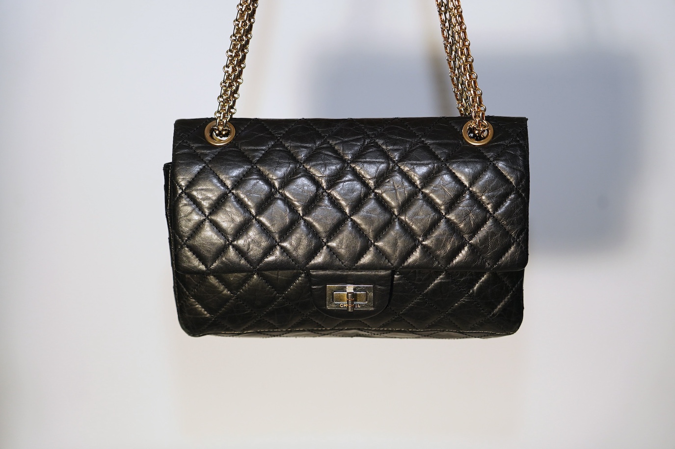 A Chanel 2.55 black leather handbag